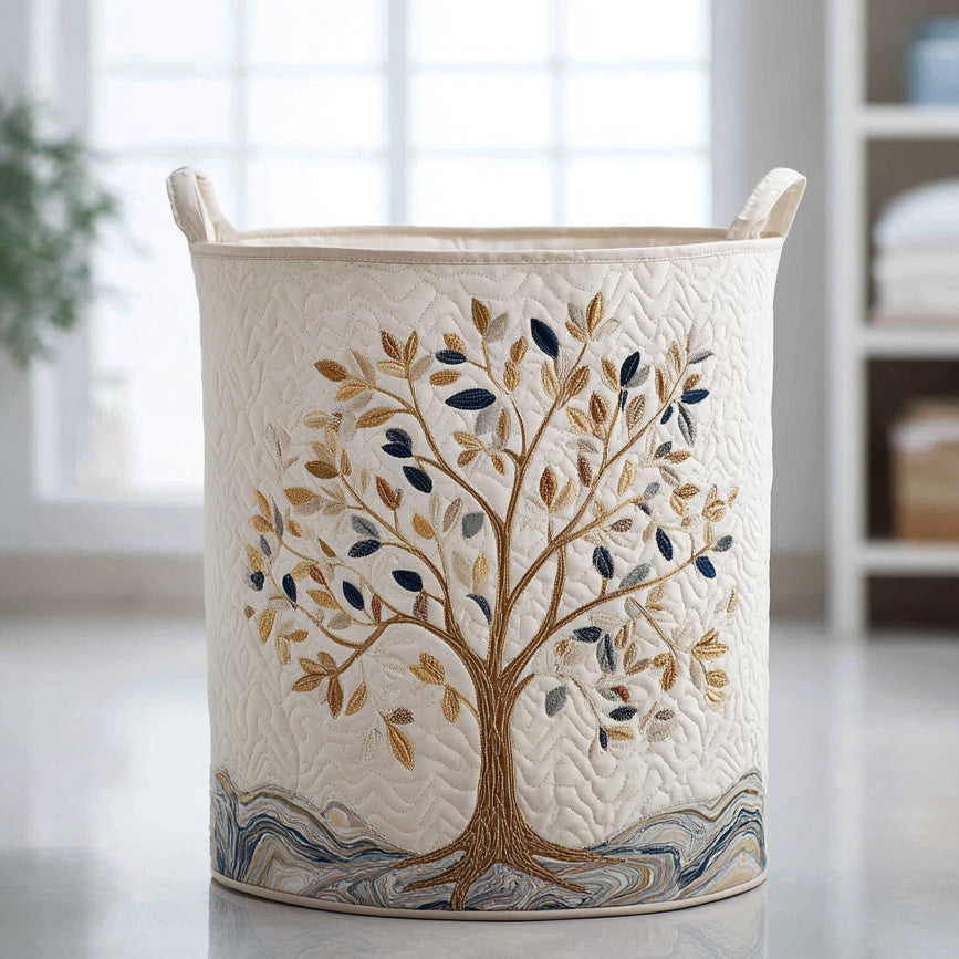 Elettra hand-quilted laundry basket with a navy and gold tree of life on cream, front view