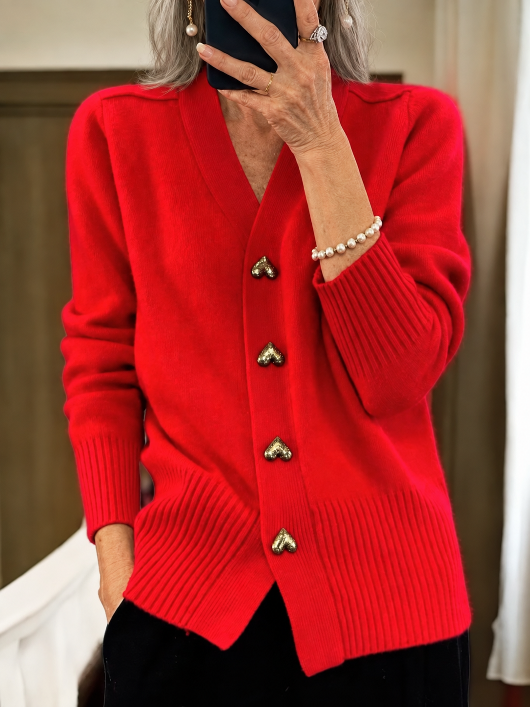 Elinor heart-button cardigan in red on mature model