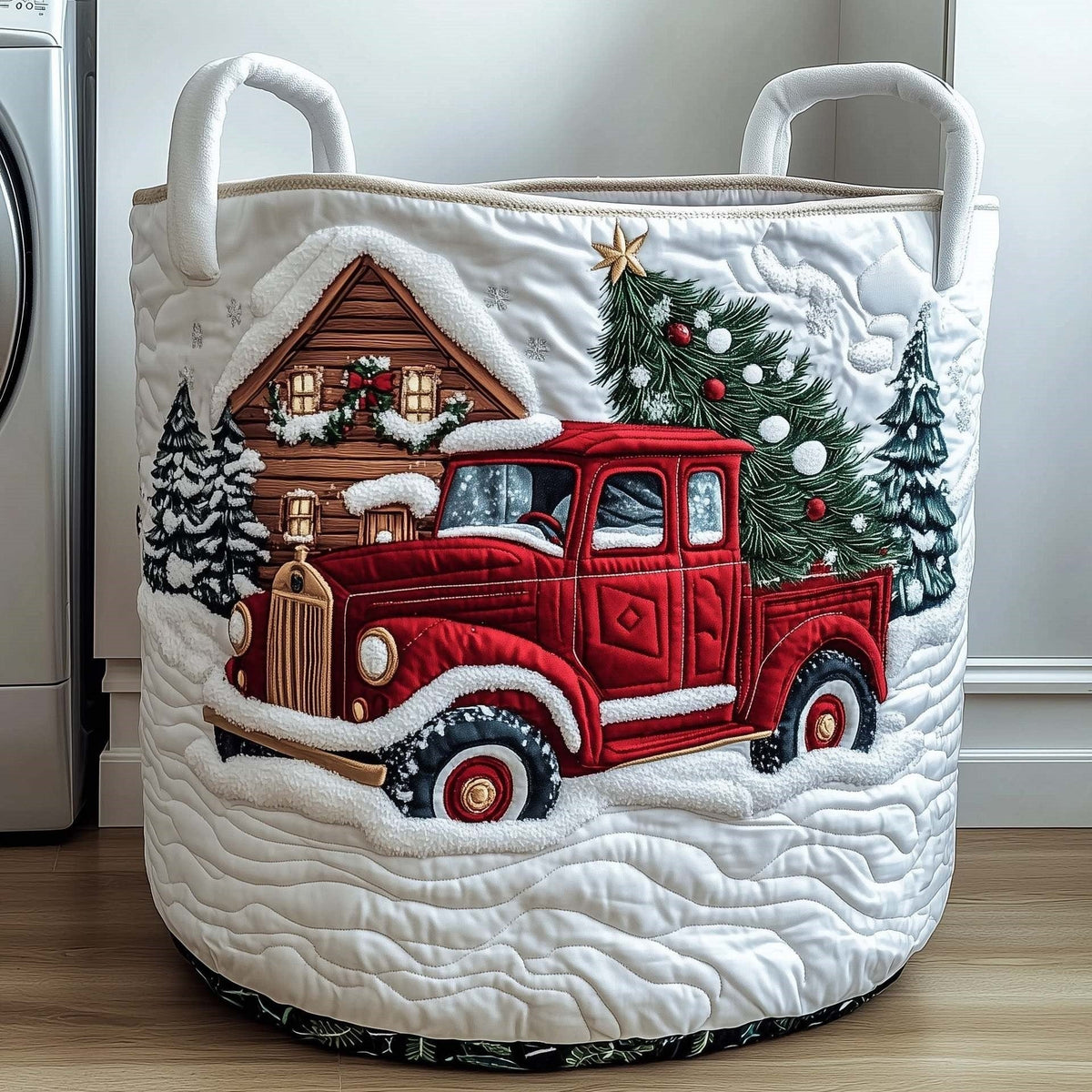 Gianna hand-quilted laundry basket with a red vintage truck carrying a Christmas tree past snowy pines and mountains, front view