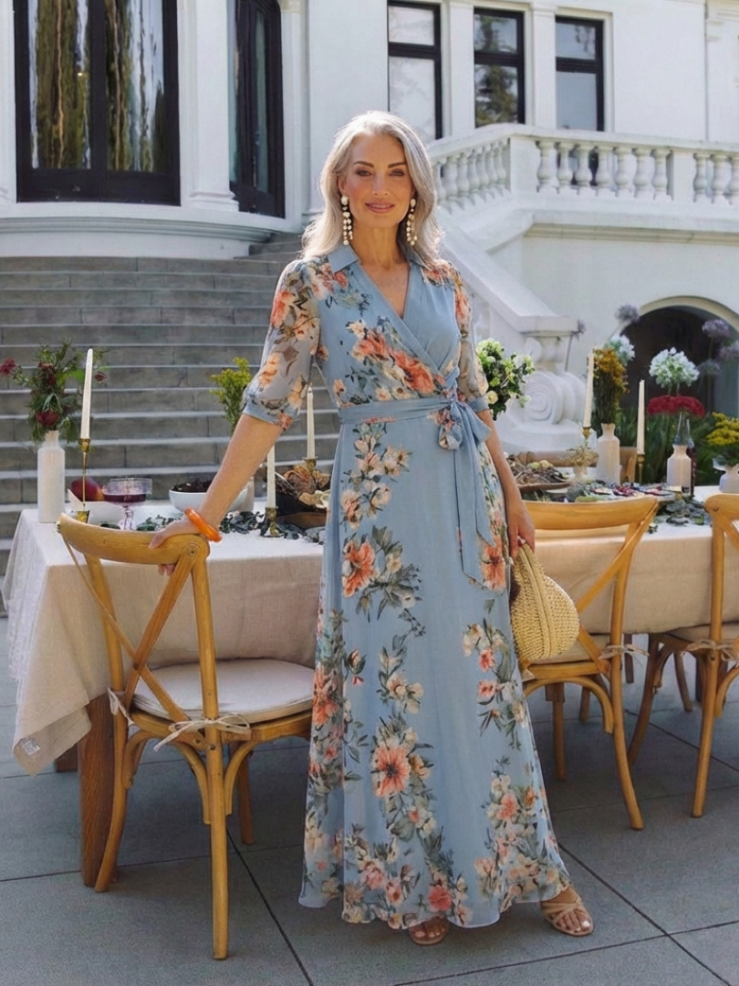 Elowen floral wrap maxi dress in blue, styled at an outdoor table setting