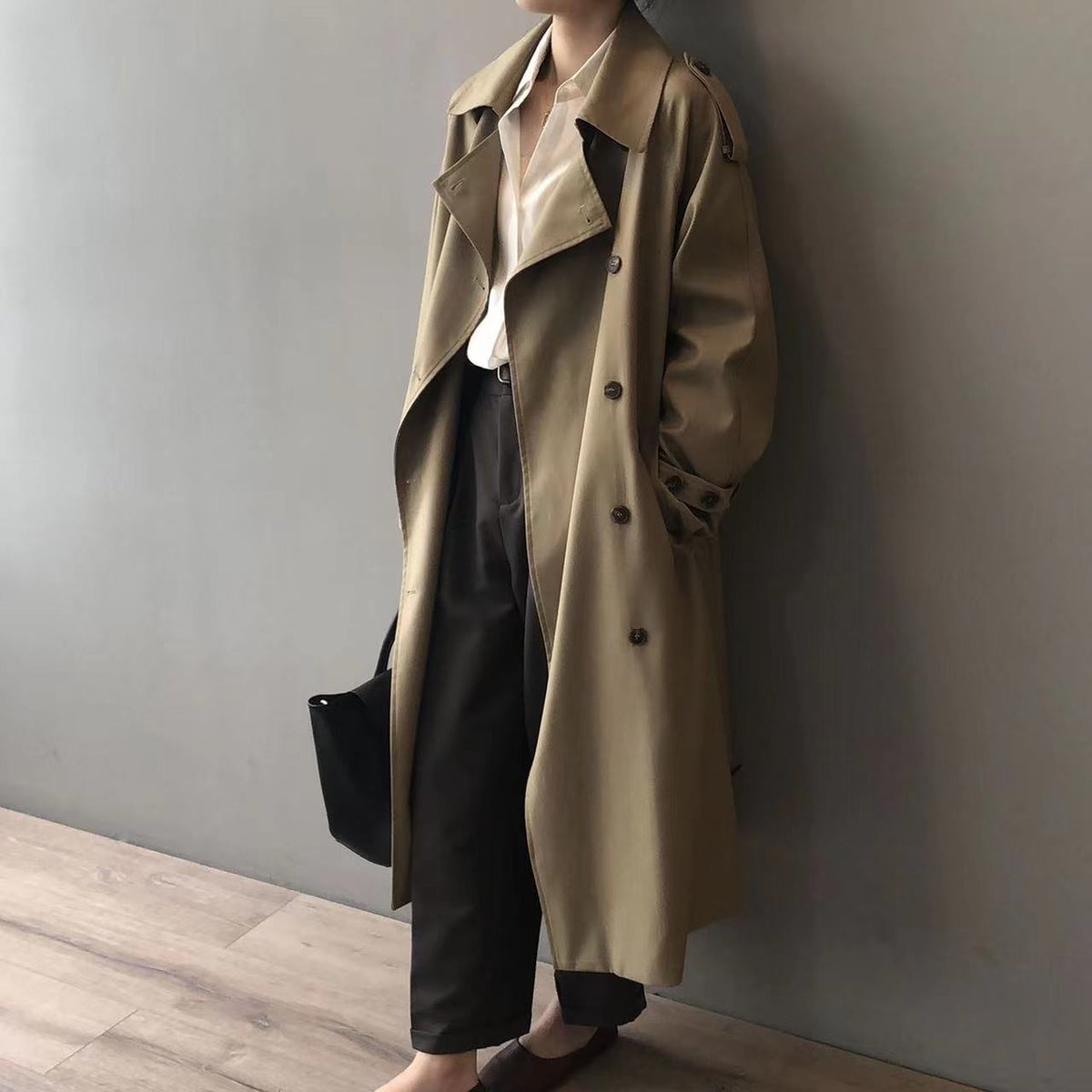 Katherine long double-breasted trench coat in khaki, side view with hands in pockets