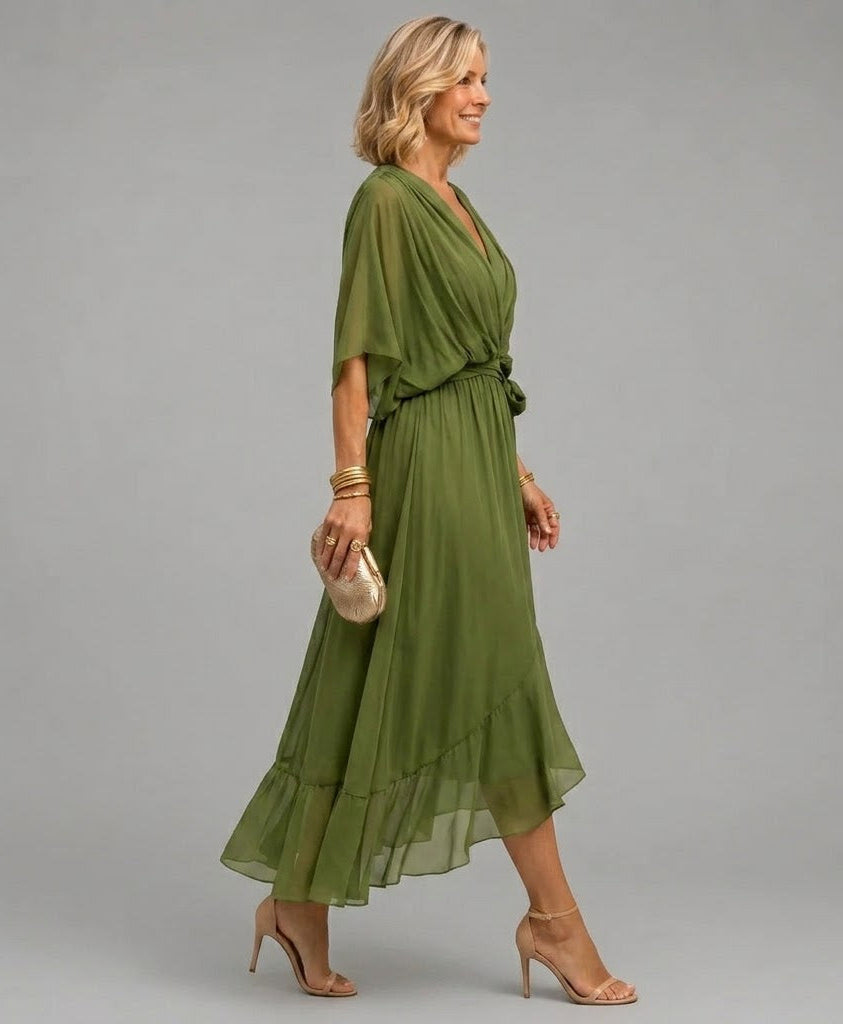 Monica wrap midi dress in green, side view showing ruffled hem
