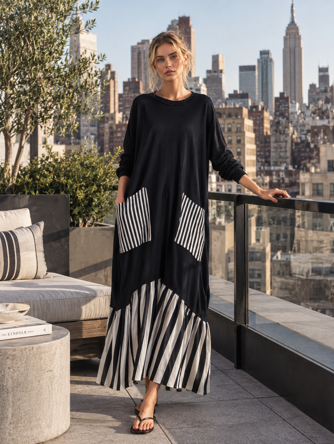 Celandine oversized stripe patchwork maxi dress in black, styled view on a terrace