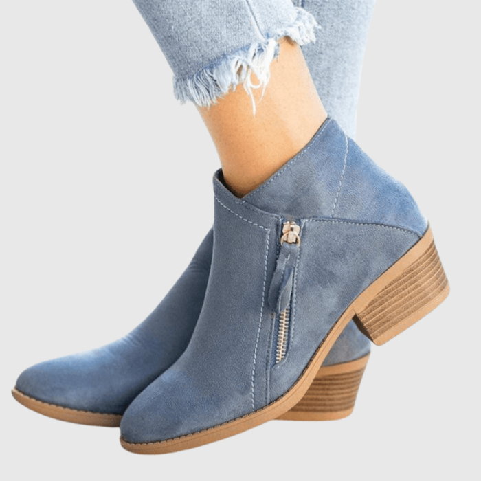 Avenya side-zip ankle boots in blue, worn with cropped jeans