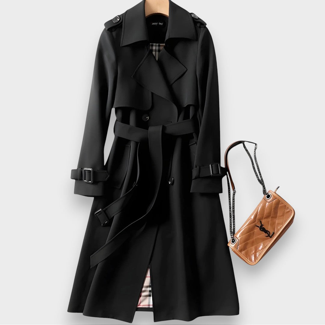 Edwina belted double-breasted trench coat in black on a hanger, front view