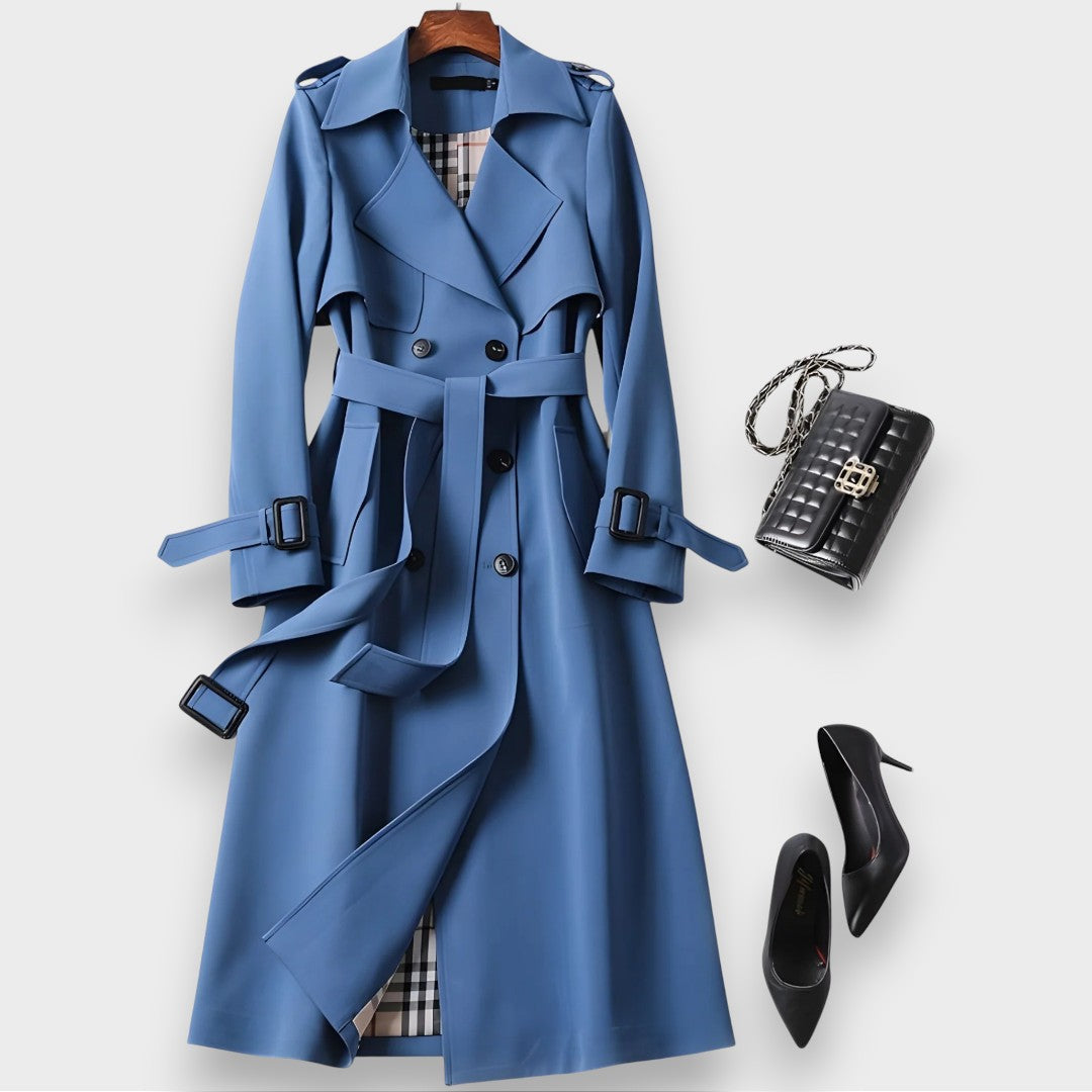 Edwina belted double-breasted trench coat in blue on a hanger, front view