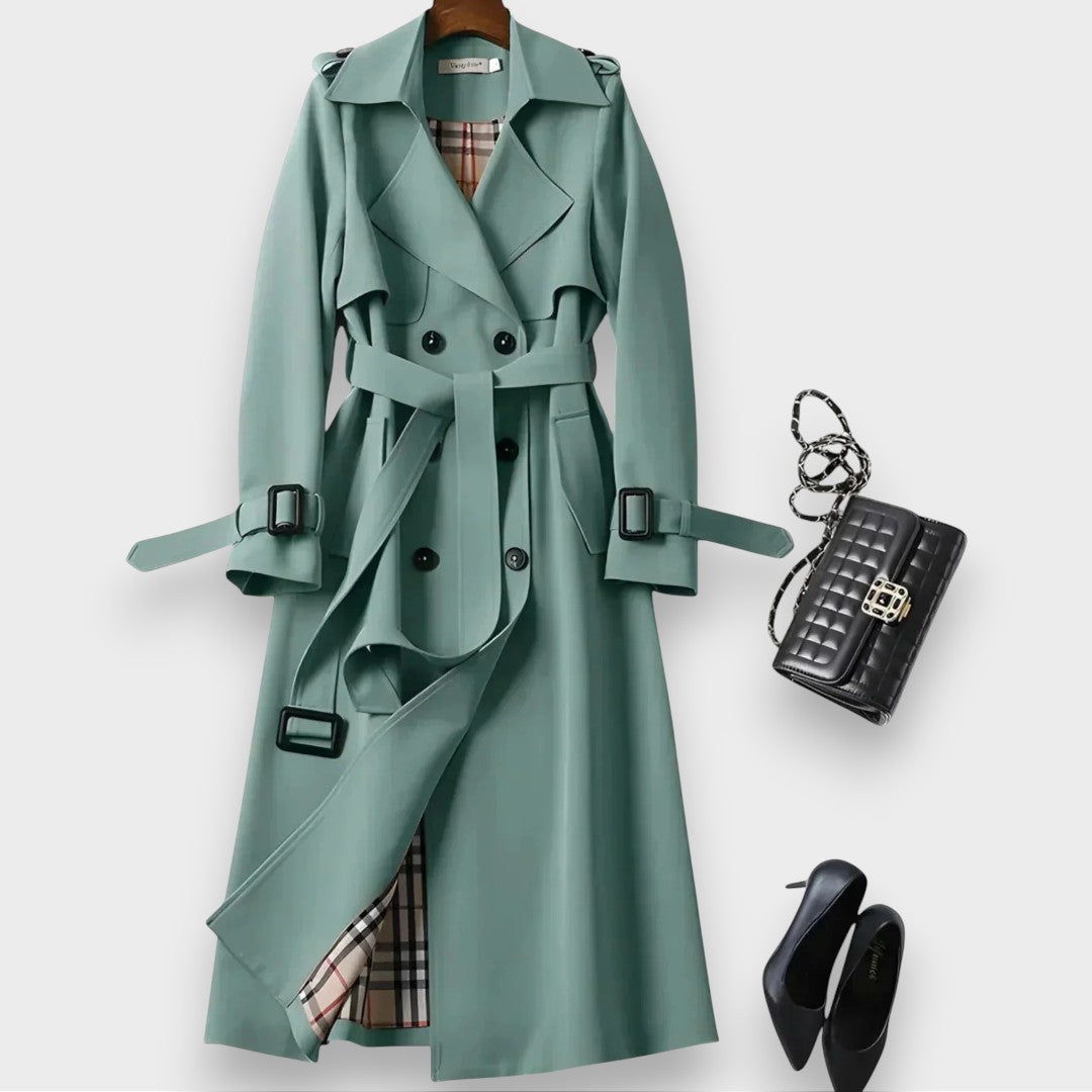 Edwina belted double-breasted trench coat in green on a hanger, front view
