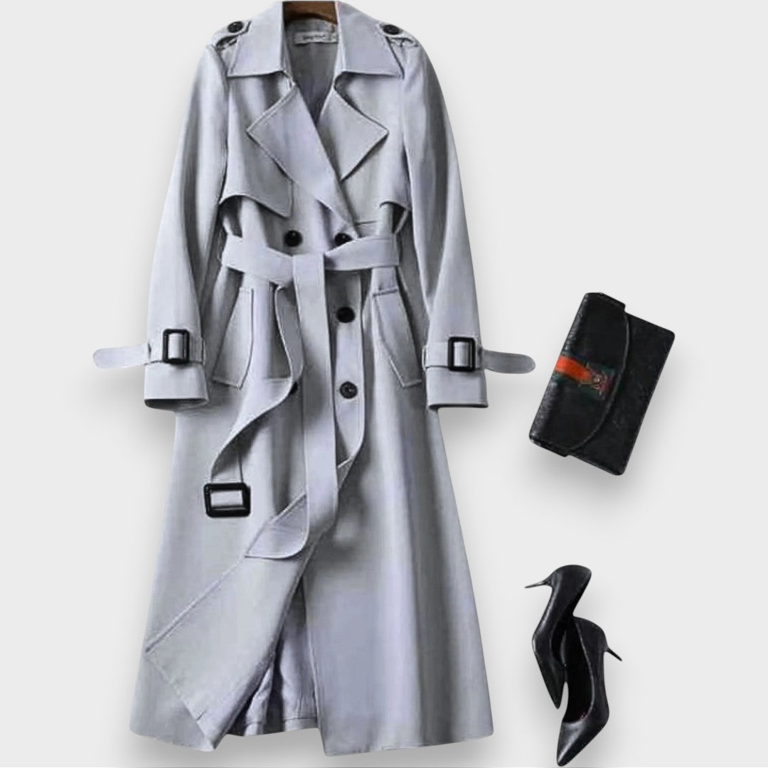 Edwina belted double-breasted trench coat in grey on a hanger, front view