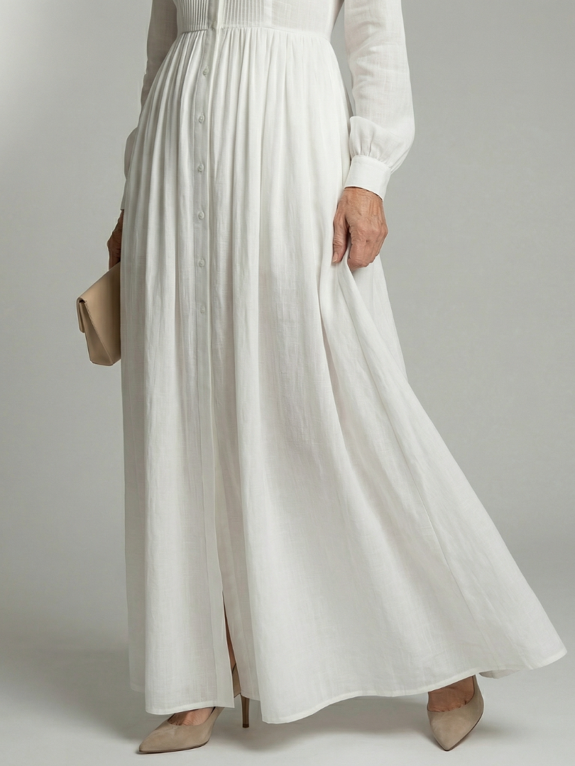 Greer pintucked maxi shirt dress in white, close-up of button front and gathered skirt