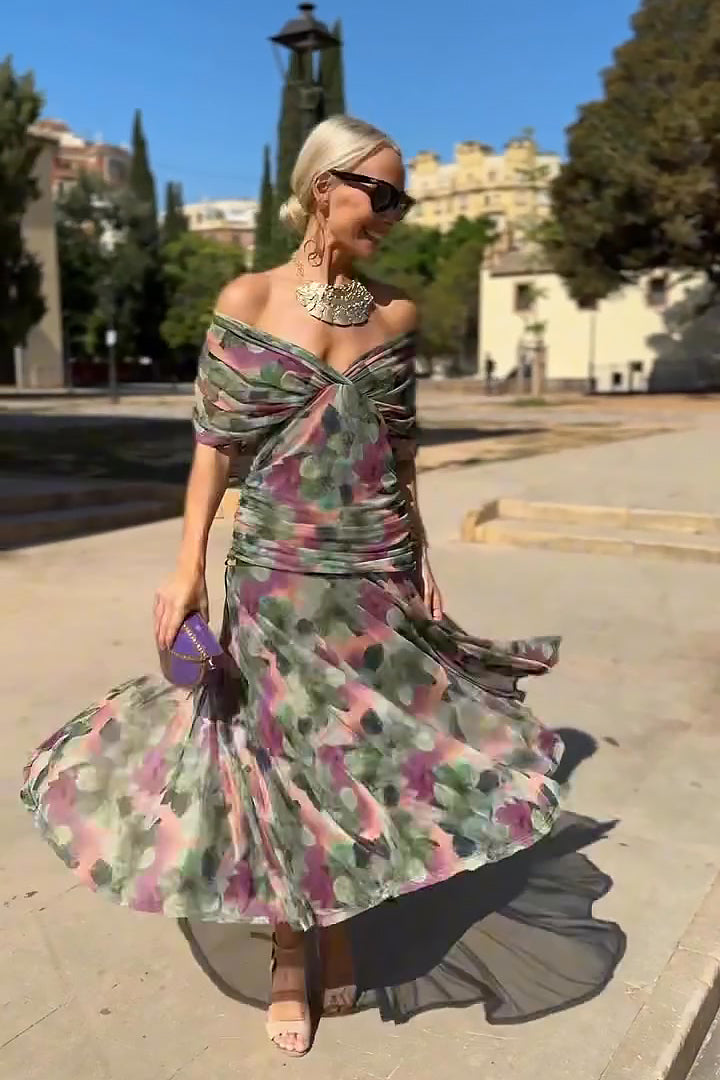 Eloísa long floral chiffon dress in green, full-length view with flared skirt in motion