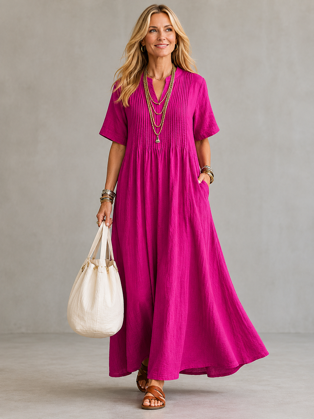 Natasha pleated maxi dress in pink, full-length front view with pin-tuck bodice