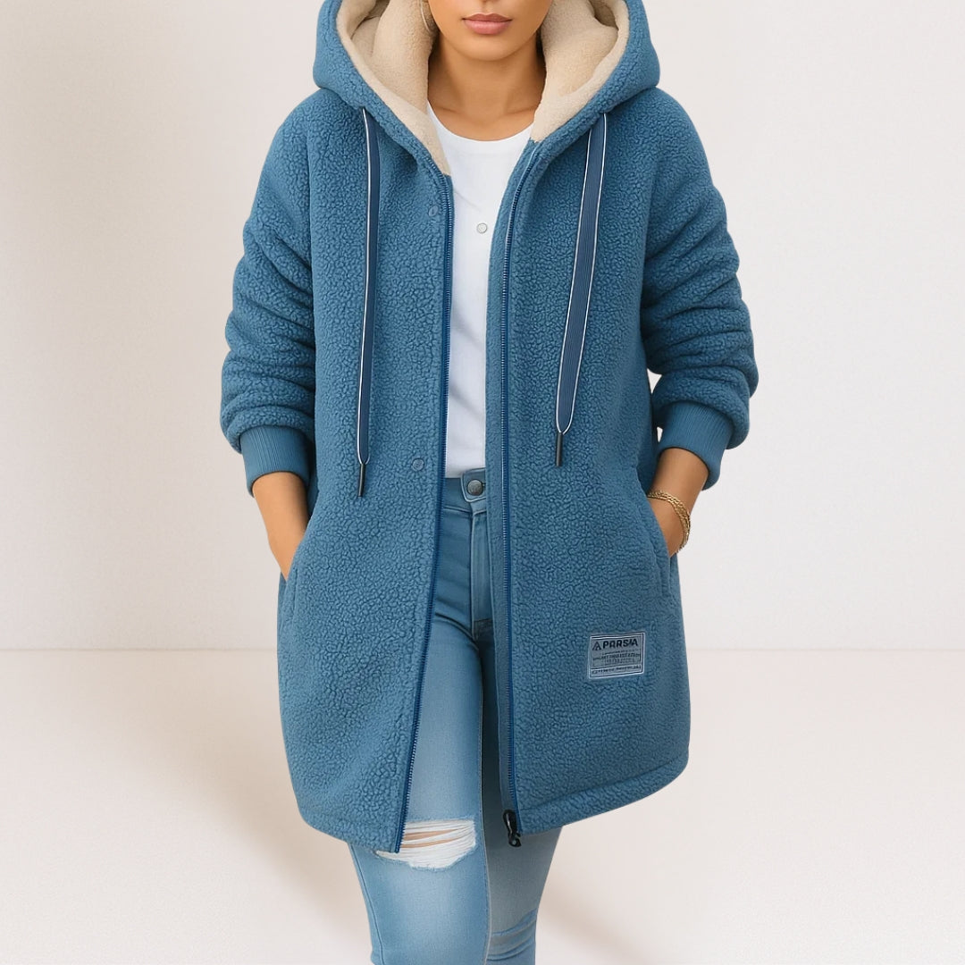 Thea longline hooded jacket in blue, worn open over jeans