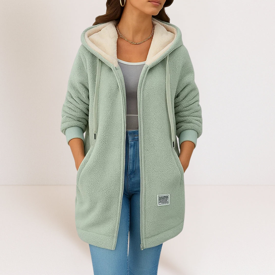Thea longline hooded jacket in green, worn open over a grey top