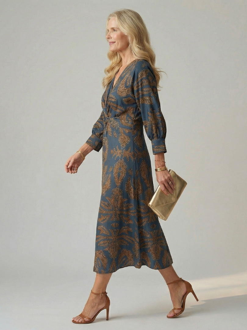 Hazel twist-front printed midi dress in blue, side view walking