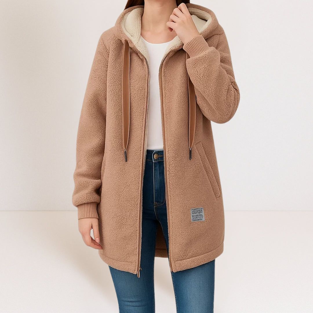 Thea longline hooded jacket in brown, worn open over a white top