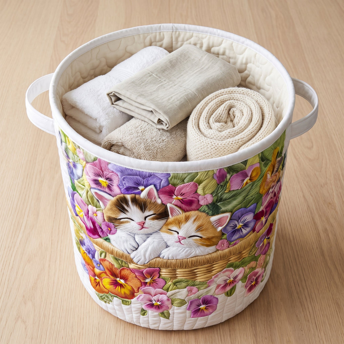 Sara hand-quilted laundry basket with two sleeping kittens among pansies, alternate view