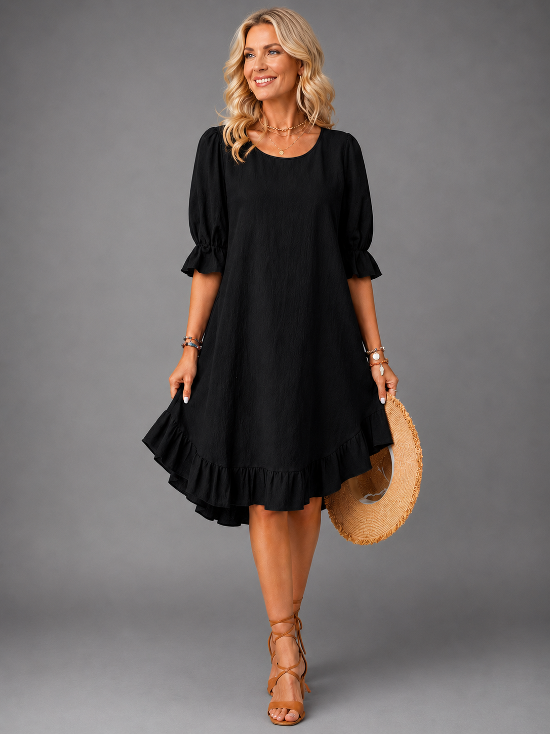 Gwen ruffle-hem swing dress in black, full-length front view