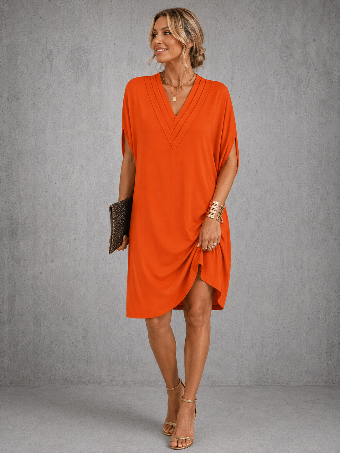 Seren pleated V-neck shift dress in orange, full-length front view