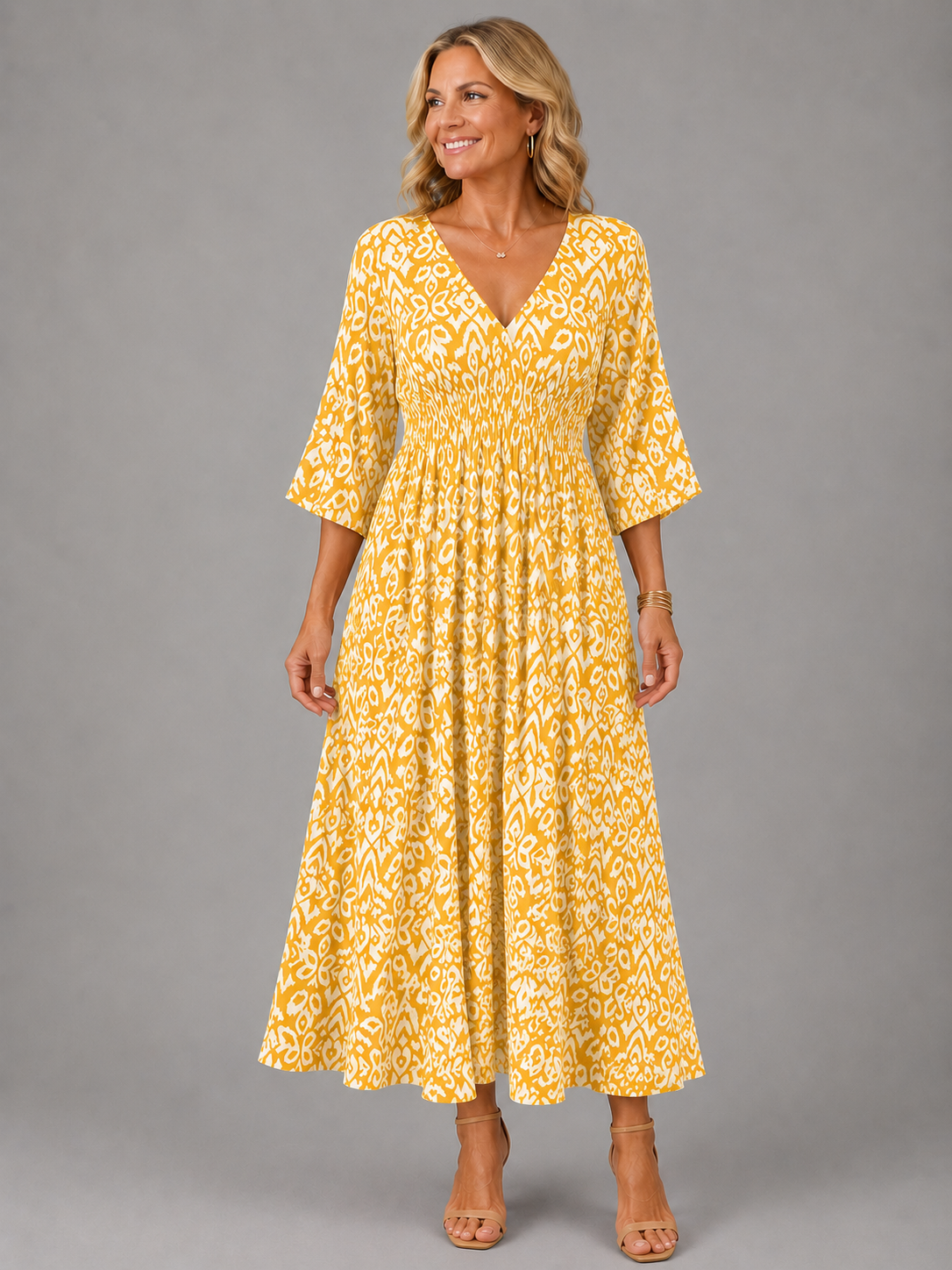 Althea smocked ikat-print midi dress in yellow, full-length front view