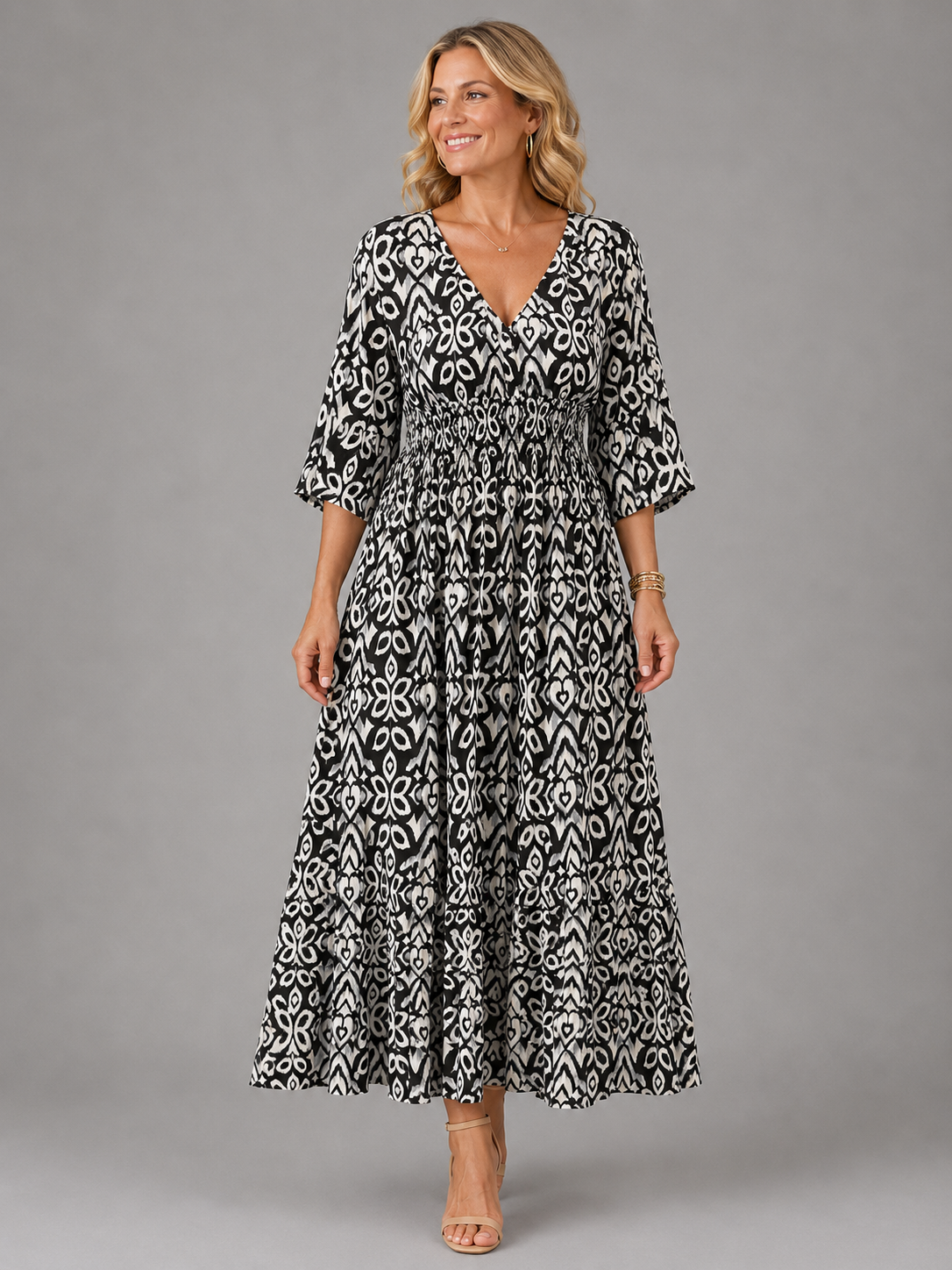 Althea smocked ikat-print midi dress in black, full-length front view