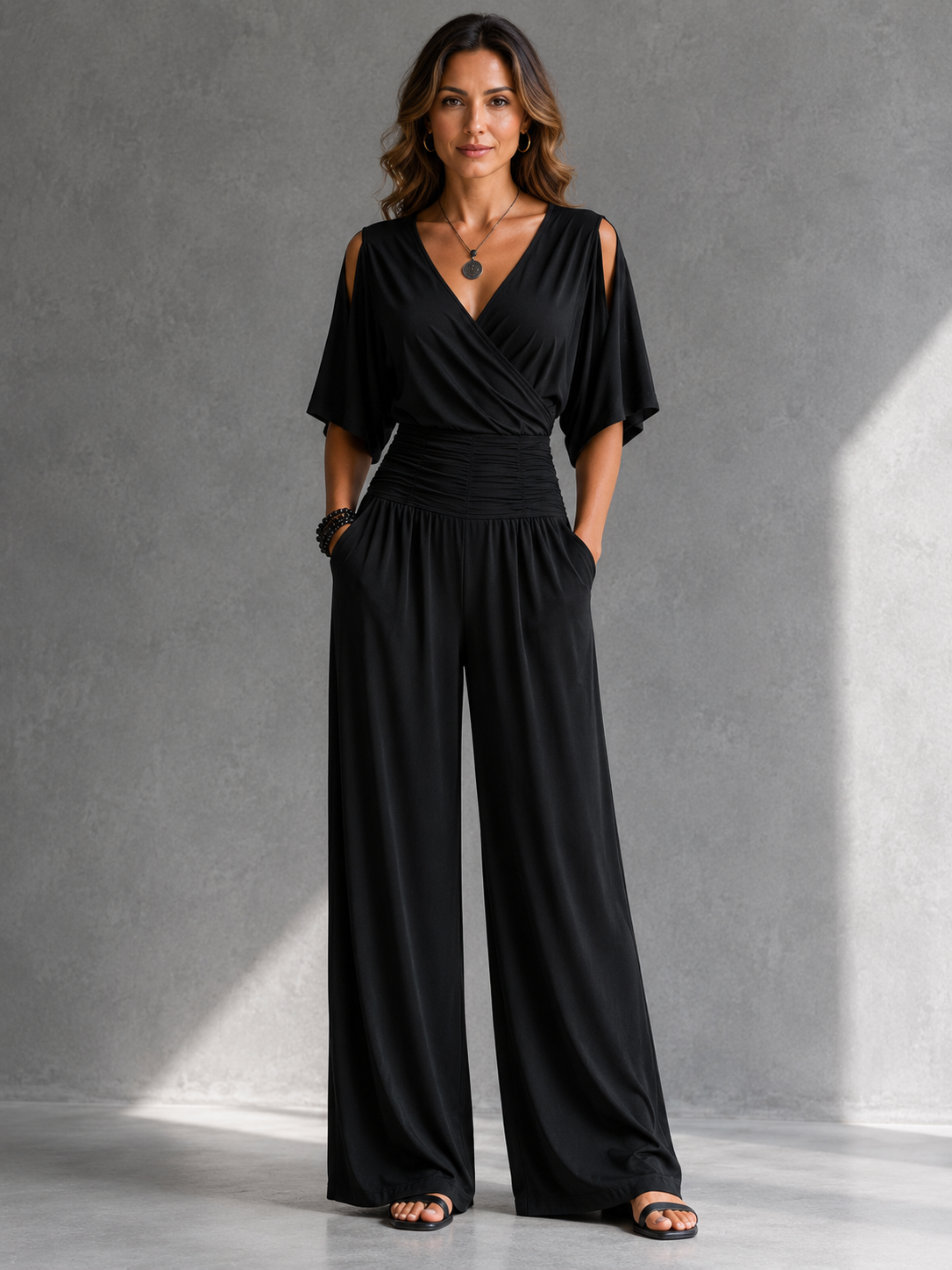 Constantia wrap jumpsuit in black, front view