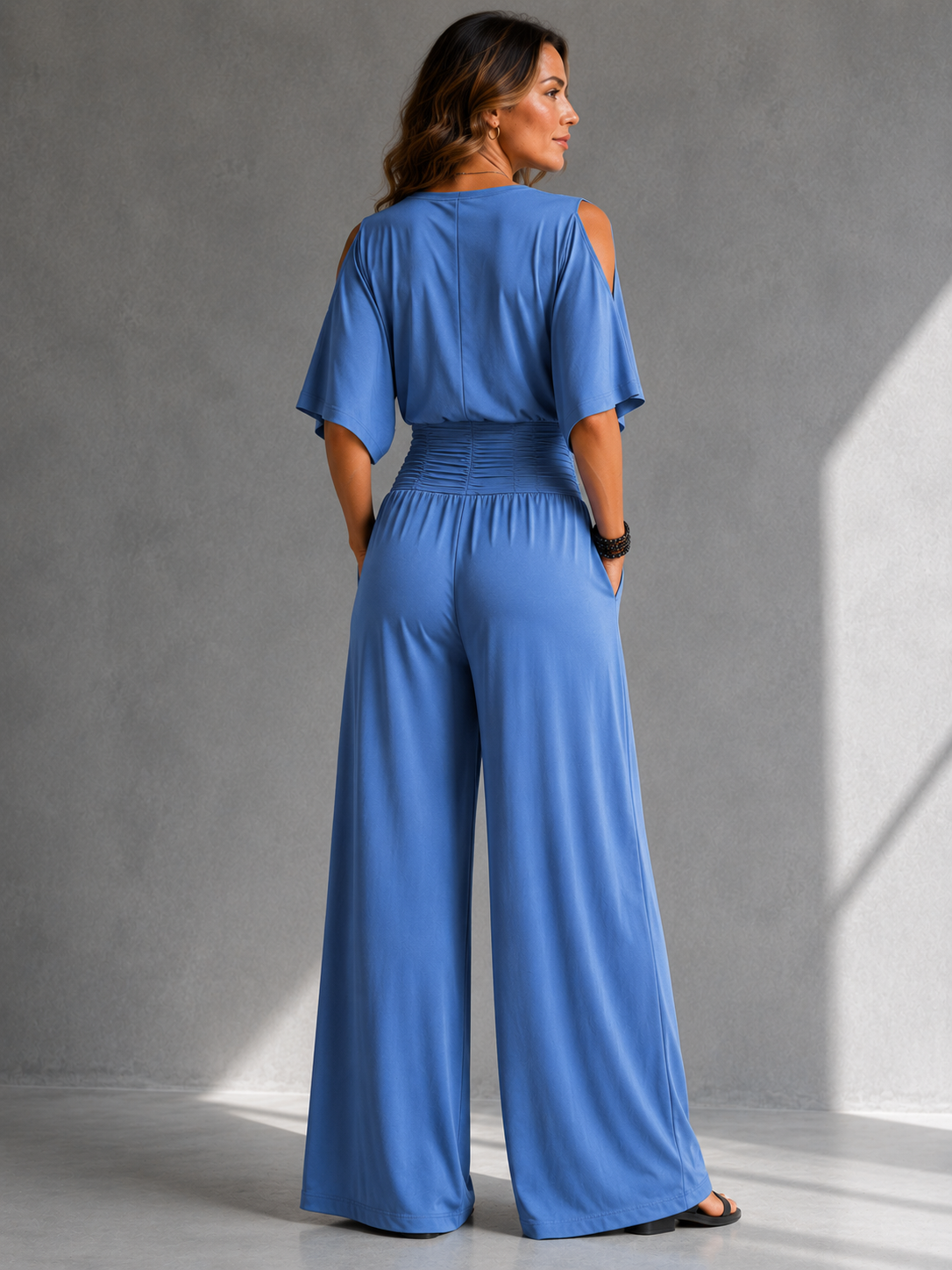 Constantia wrap jumpsuit in blue, back view