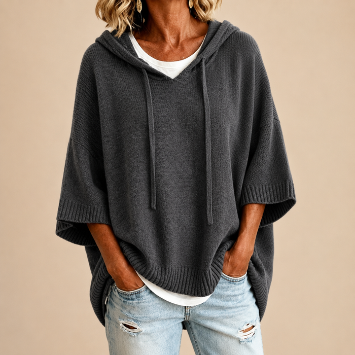 Hooded knit poncho in grey, front view