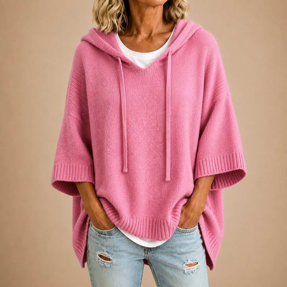 Hooded knit poncho in pink, front view