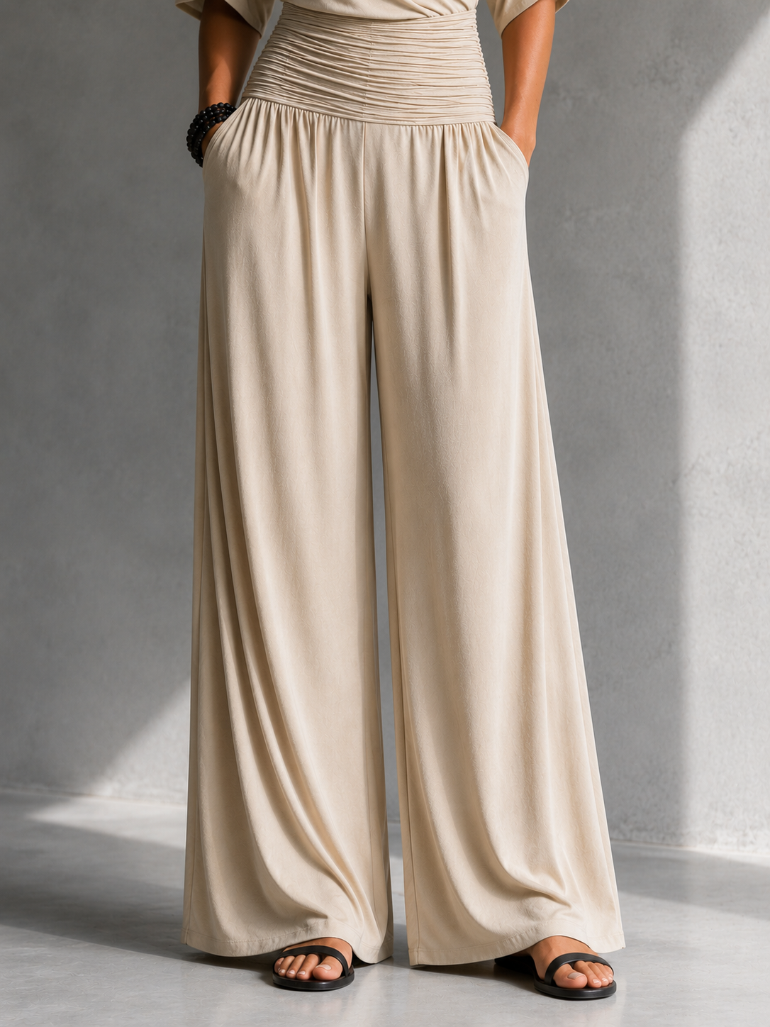 Georgie wrap wide-leg jumpsuit in beige, close-up of wide legs and side pockets