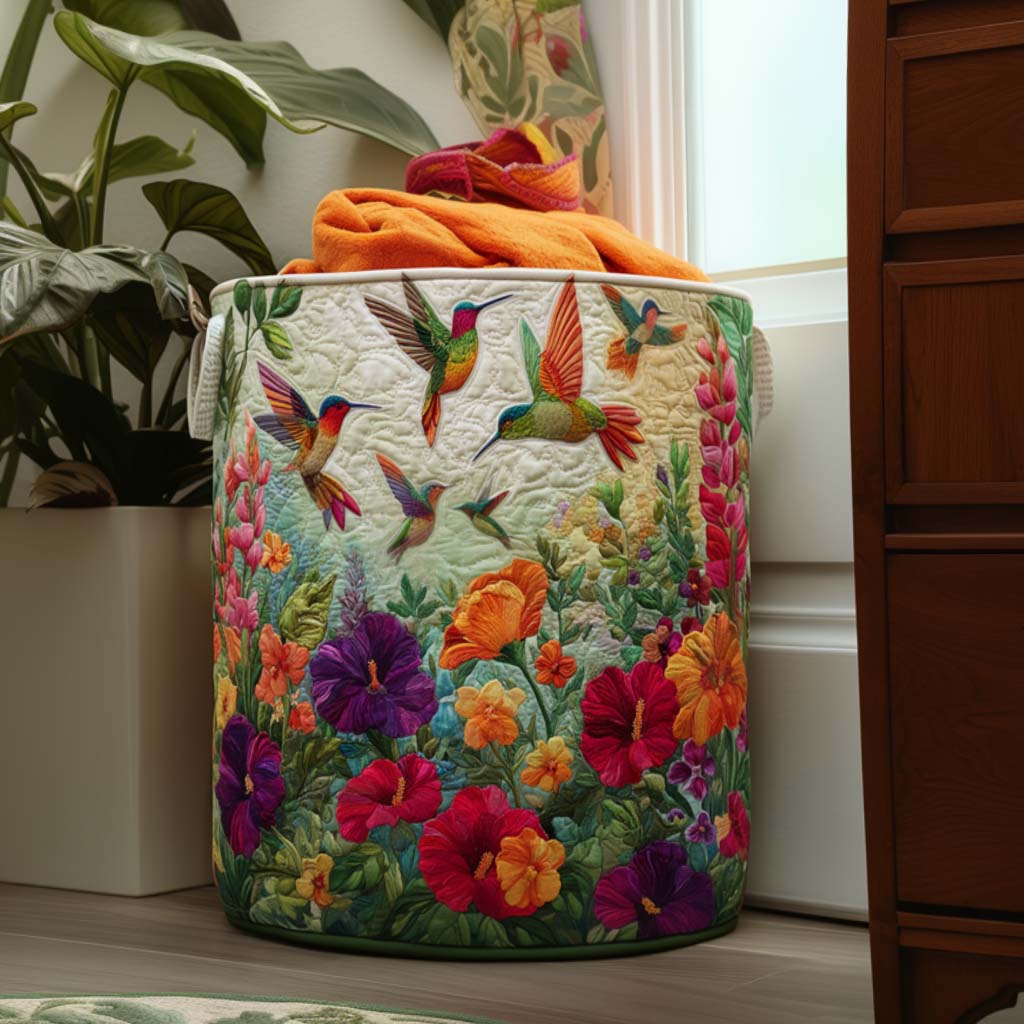 Antonella hand-quilted laundry basket with hummingbirds over garden flowers, front view