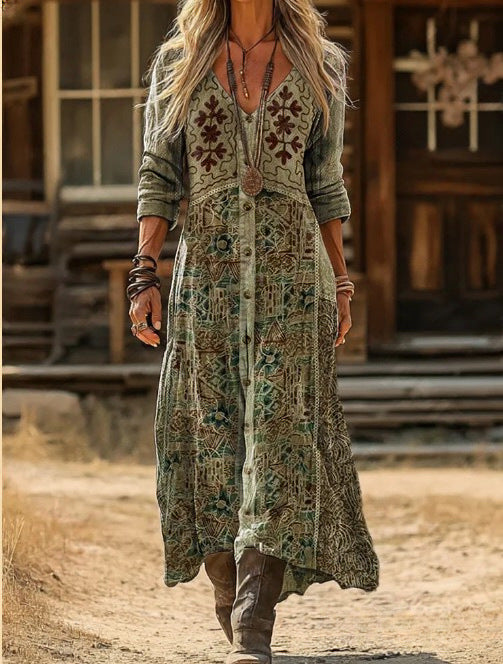 Linnet botanical print maxi dress in olive green, worn outdoors with boots