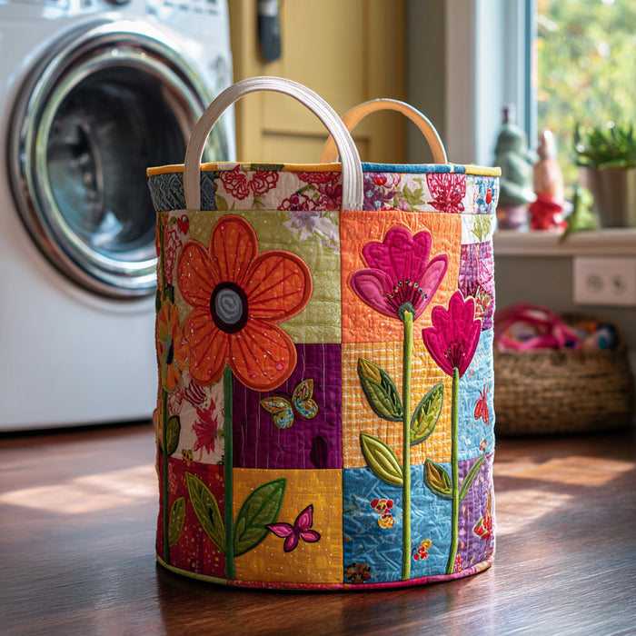 Zita hand-quilted laundry basket with bold patchwork flowers and butterflies in bright pink, orange and purple, front view