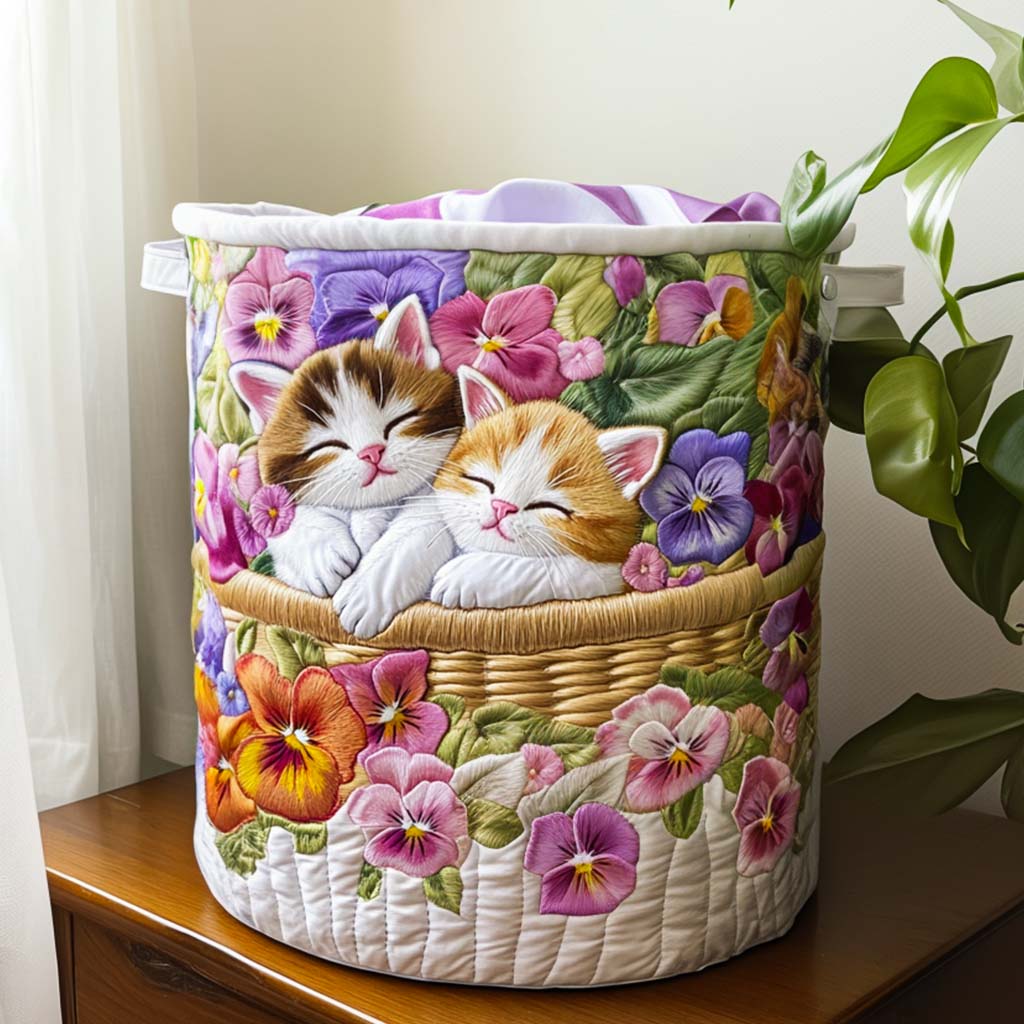 Sara hand-quilted laundry basket with two sleeping kittens among pansies, front view by a window