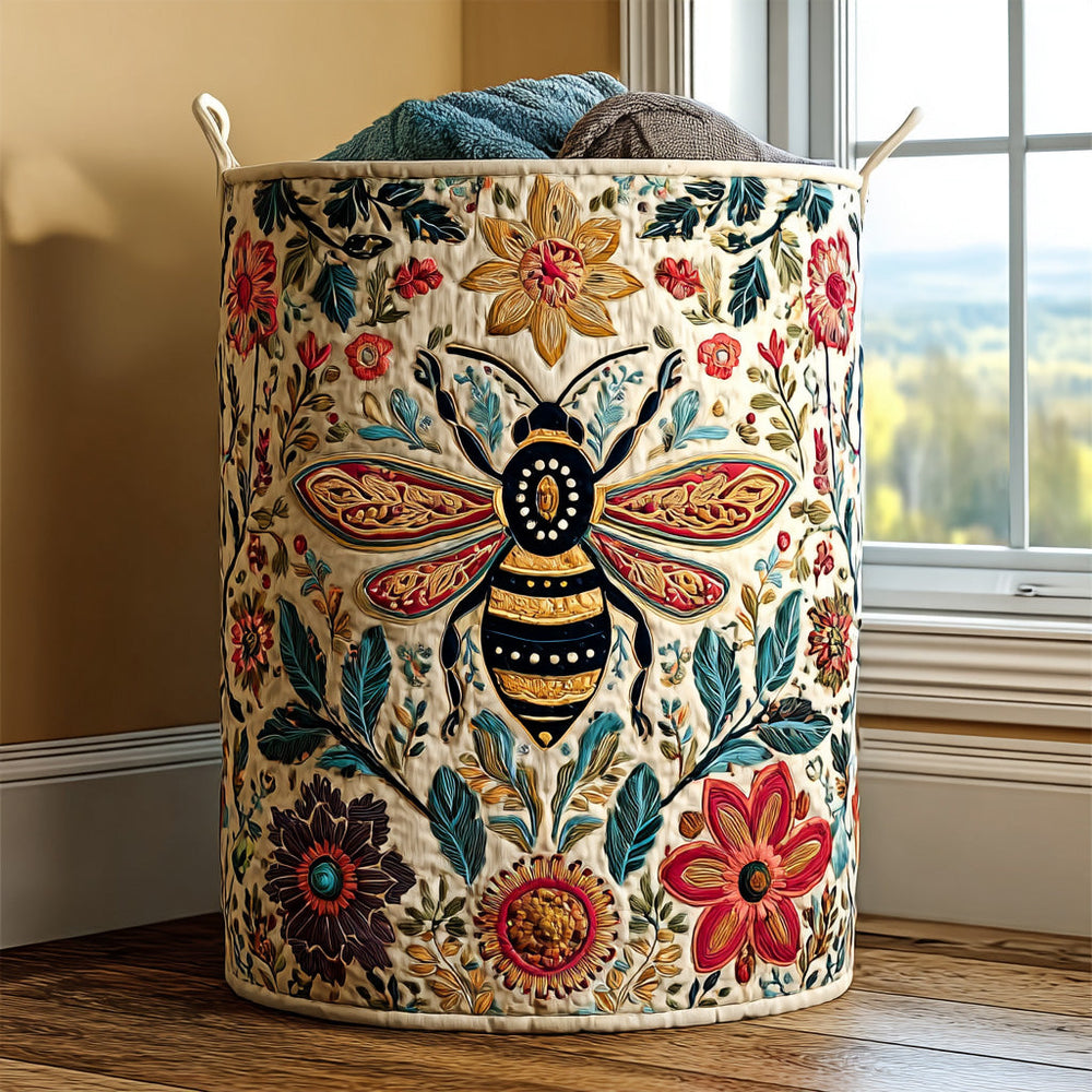 Valentina hand-quilted laundry basket with a folk-art bee surrounded by red, orange and navy flowers, front view