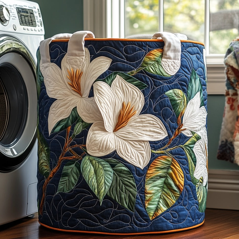 Mara hand-quilted laundry basket with large white magnolia blooms on deep navy, front view