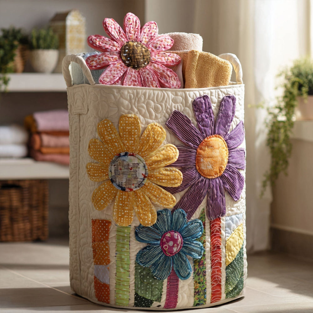 Tiziana hand-quilted laundry basket with oversized patchwork daisies in yellow, purple and teal, front view