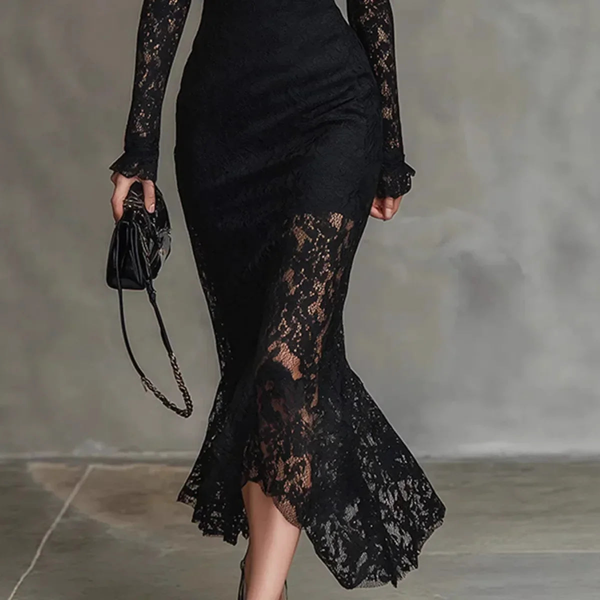 Lowena high-neck lace maxi dress in Black, close-up of fluted lace hem
