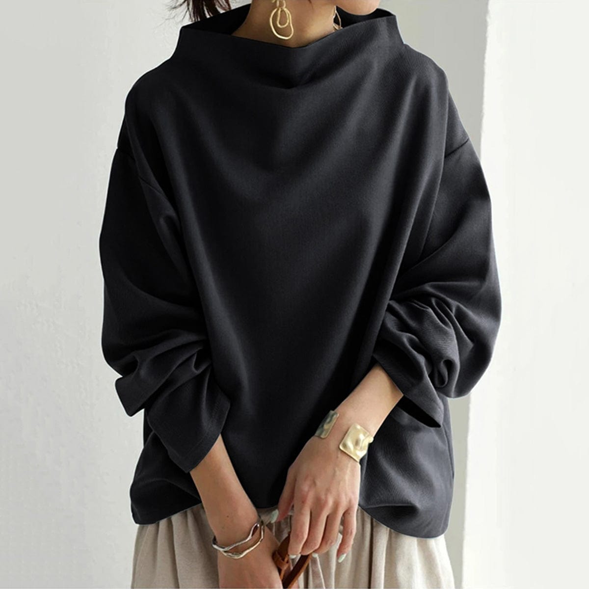 Elly funnel-neck relaxed top in black, front view