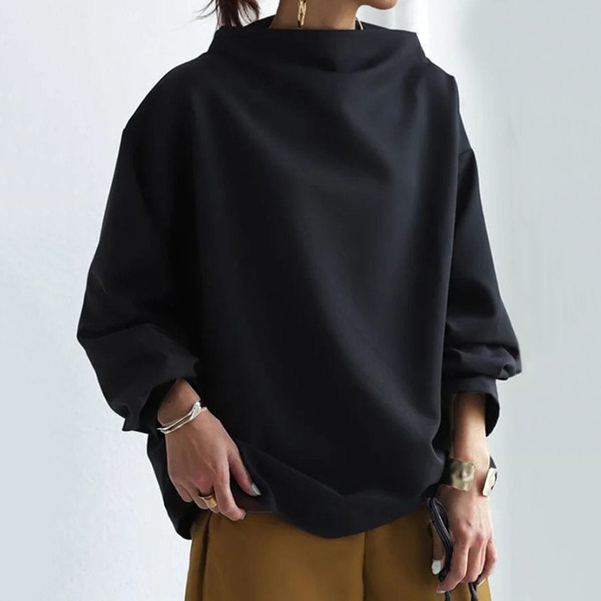 Elly funnel-neck relaxed top in black, front view