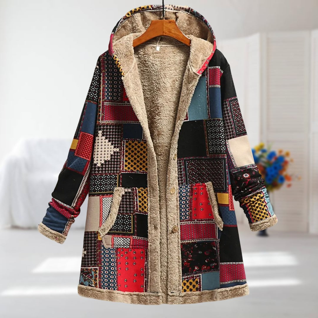 Lina patchwork hooded coat in red multicolour with plush trims, front view on a hanger
