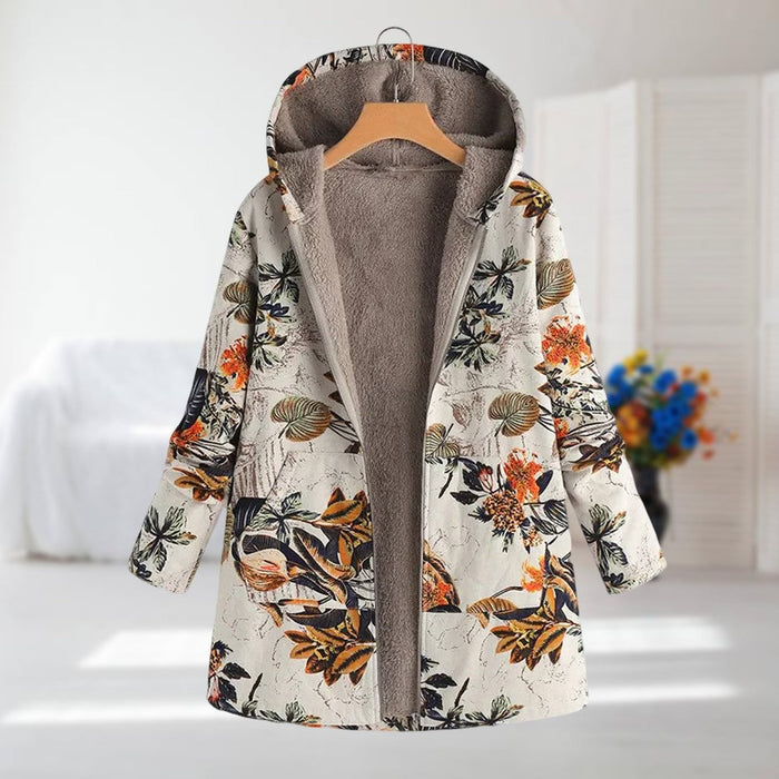 Clara hooded leaf print coat in cream and orange, front view on a hanger