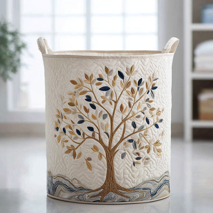 Aurora hand-quilted laundry basket in cream with embroidered tree design