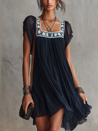 APOLLINE | NAVY FLORAL-EMBROIDERED PLEATED MINI DRESS