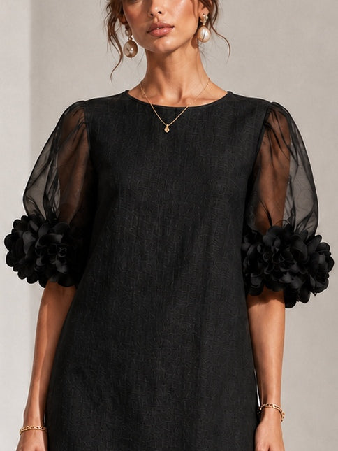 Minette puff-sleeve mini dress in black, sleeve detail view