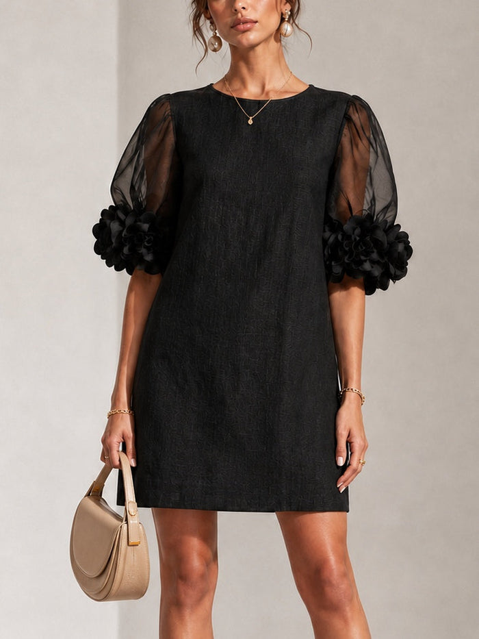 Minette puff-sleeve mini dress in black, front view