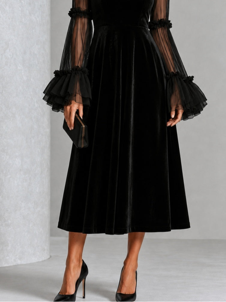 Stephanie black velvet midi dress, close-up of A-line skirt and layered ruffle cuffs
