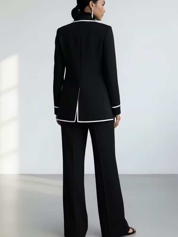 Claudia contrast-piped trouser suit in black, full-length back view