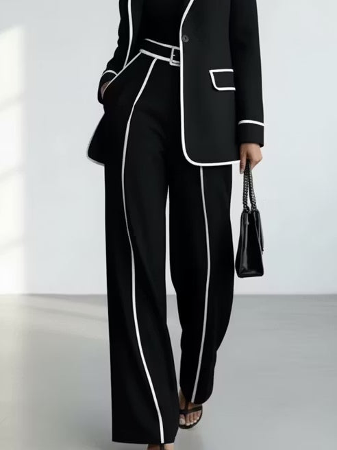 Claudia contrast-piped trouser suit in black, close-up of piped wide-leg trousers