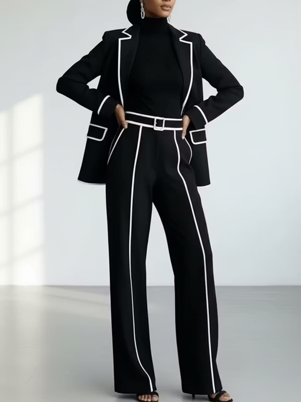 Claudia contrast-piped trouser suit in black, front view with matching belt