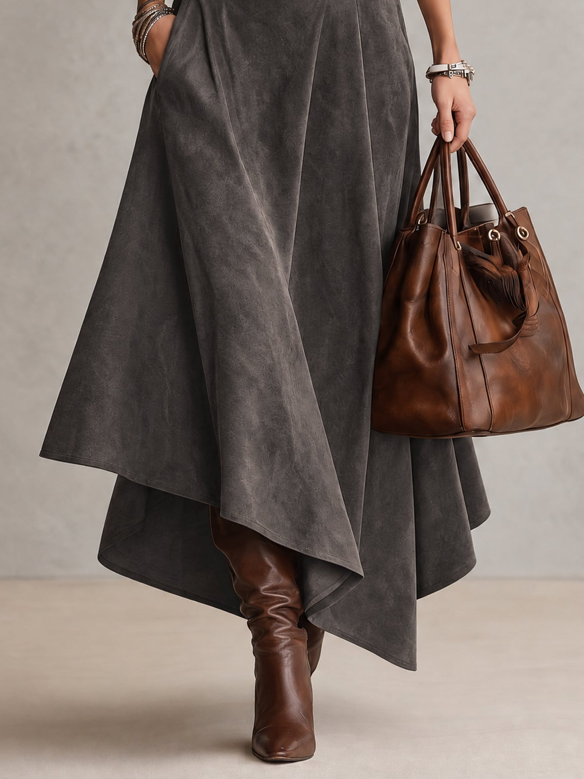 Delphina turtleneck top and asymmetric midi skirt set in grey, skirt hem detail